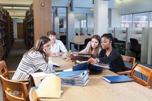 From left to right, law students Kristin Ries, Timothy Alexander, Celeste Kinney and Kendra Pruitt prepare their cases for the Life Without Parole project. Photo by Russell Cothren