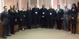 From Left, 3L Final Round participants in the Region IX rounds of the 64th Annual National Moot Court Competition. Arkansas third year law students Daniel Yim, Mallory Langston, and Valerie Morato; the Honorable Associate Justice Courtney Hudson Goodson of the Arkansas Supreme Court; U.S. Magistrate Judge Erin Setser of the Western District of Arkansas; the Honorable Judge Kenneth Hixson of the Arkansas Court of Appeals; the Honorable Lavenski Smith of the Eighth Circuit Court of Appeals; the Honorable Chief Judge Robert Gladwin of the Arkansas Court of Appeals; Creighton law students Jimmie Pinkham III, Steven Hennelly, and Brittany Faulkner.