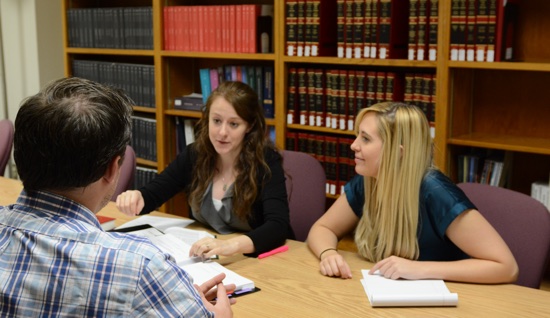 Student lawyers interviewing a client