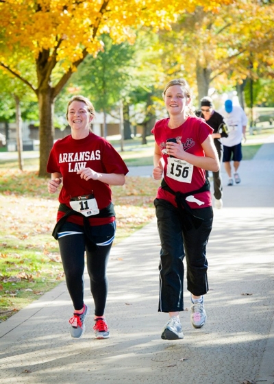 Students running on campus