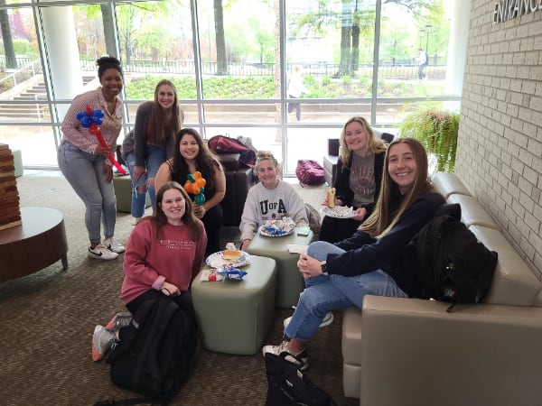 students enjoying a Wellness Wednesday event in the atrium.
